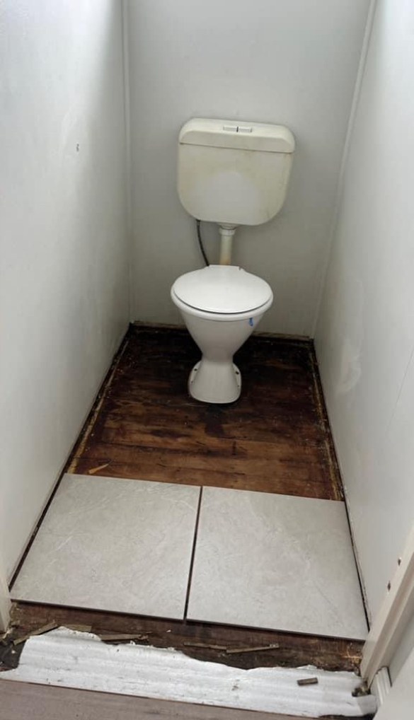 Mid-reno — Floor stripped back and re-tiled